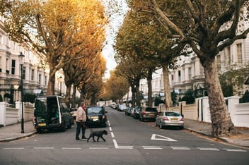Man walking a dog outside